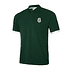 Dunkelgrünes Polo mit weißem FCA-Wappen und weißen Ärmelbündchen (Vorderansicht). (1)