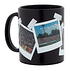 FCA Tasse in schwarz mit mehreren Polaroid Bildern darauf die bei Hitze sichtbar werden (1)